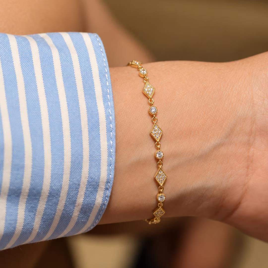 Art Deco Diamond Station Bracelet in yellow gold worn on wrist