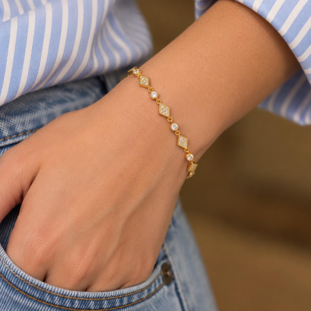 Art Deco Diamond Station Bracelet in yellow gold worn on wrist