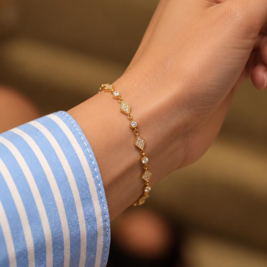 Art Deco Diamond Station Bracelet in yellow gold worn on wrist