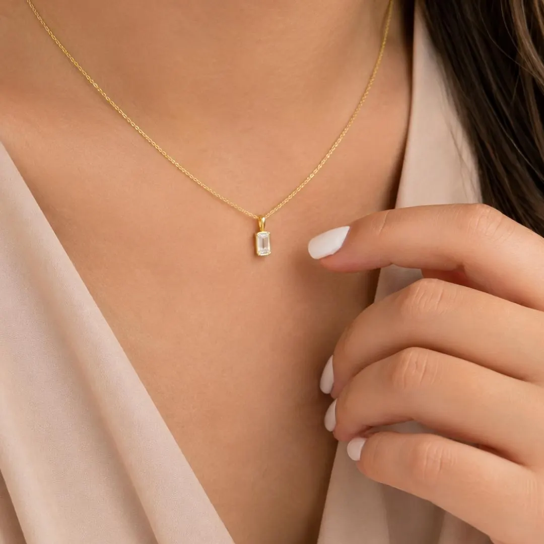 Emerald cut diamond pendant styling; chain not included