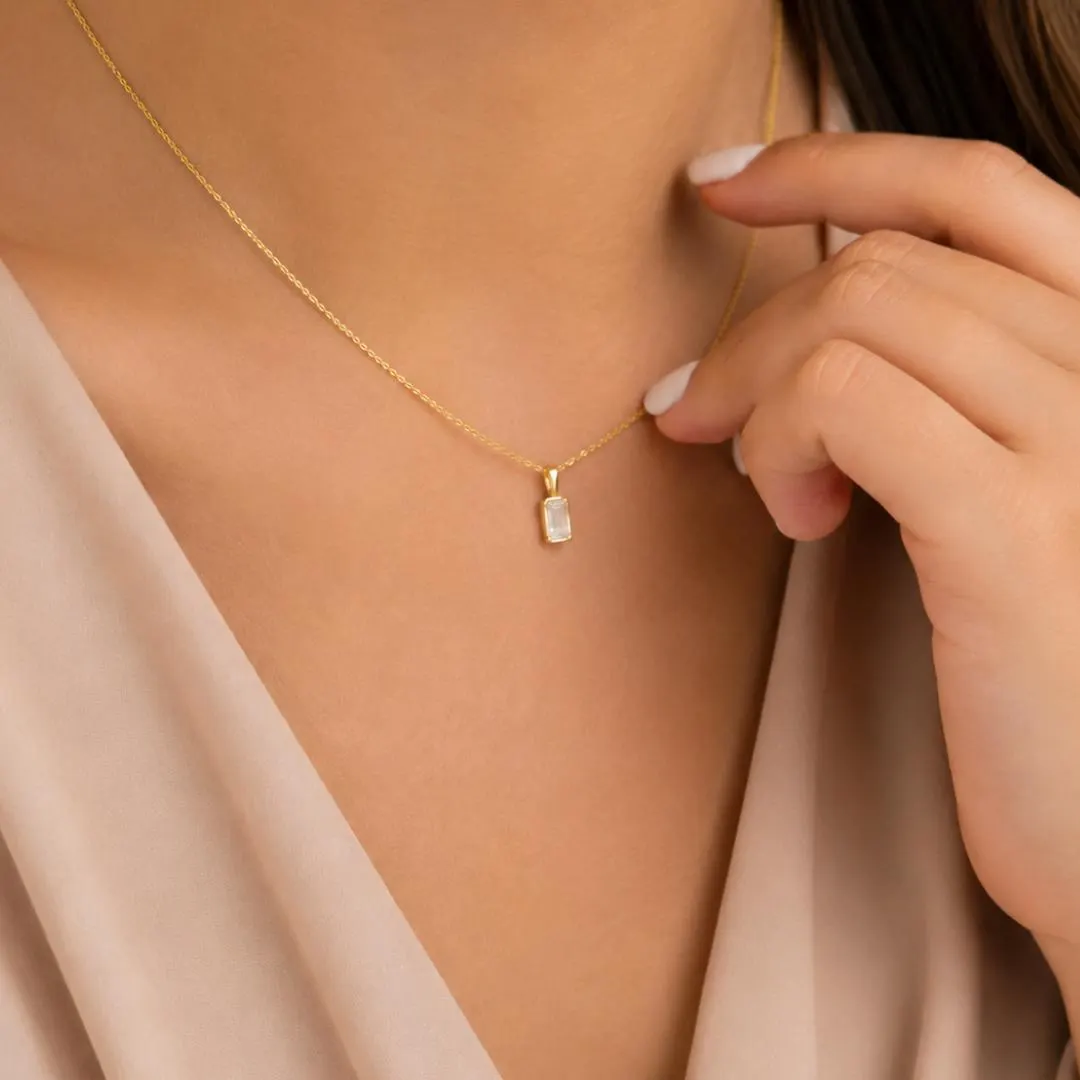 Emerald cut diamond pendant styling; chain not included