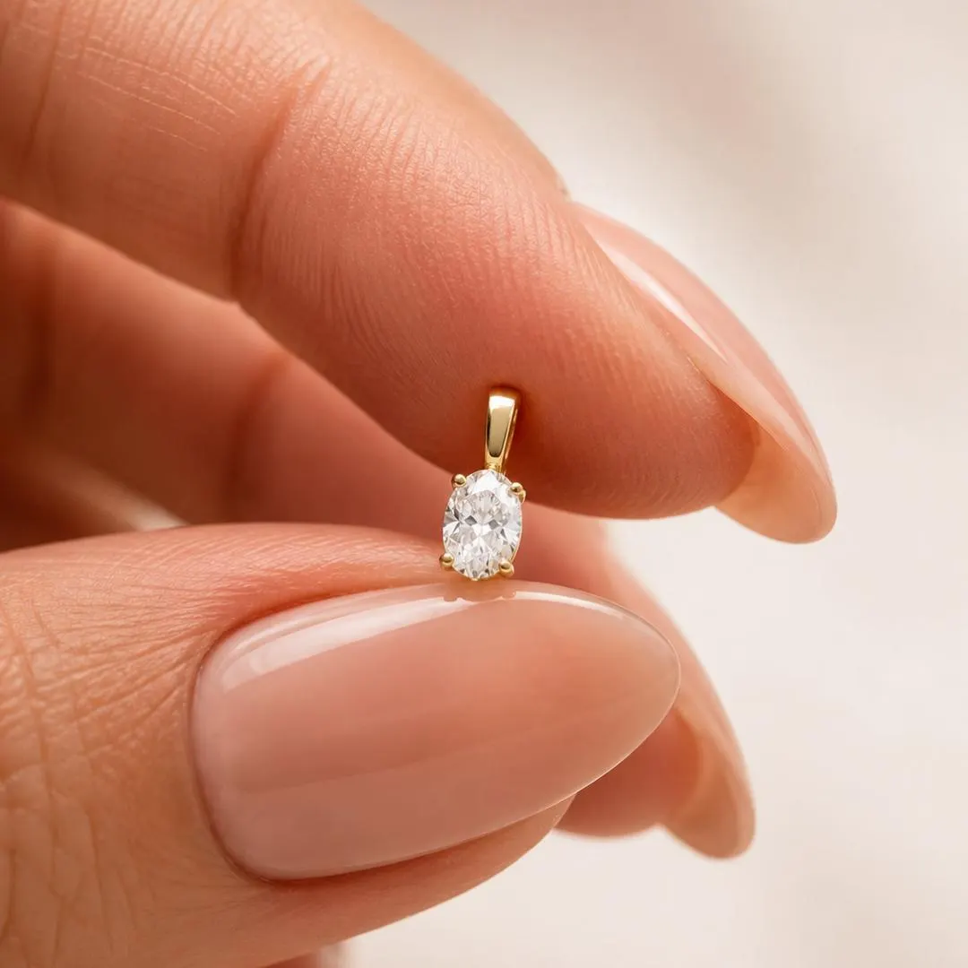 AuvelleCo oval diamond solitaire pendant with plain gold bail