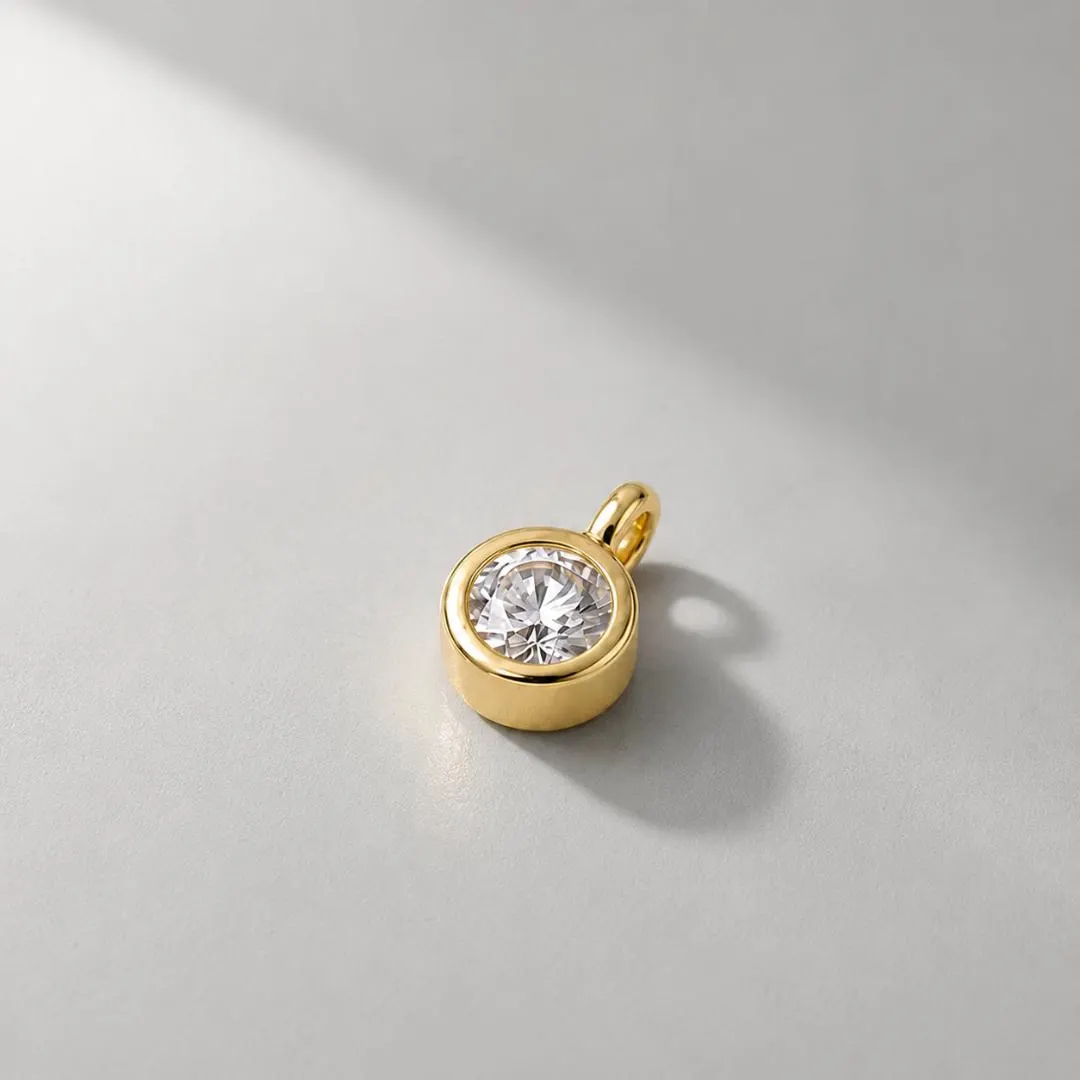 AuvelleCo round bezel diamond solitaire pendant in yellow gold