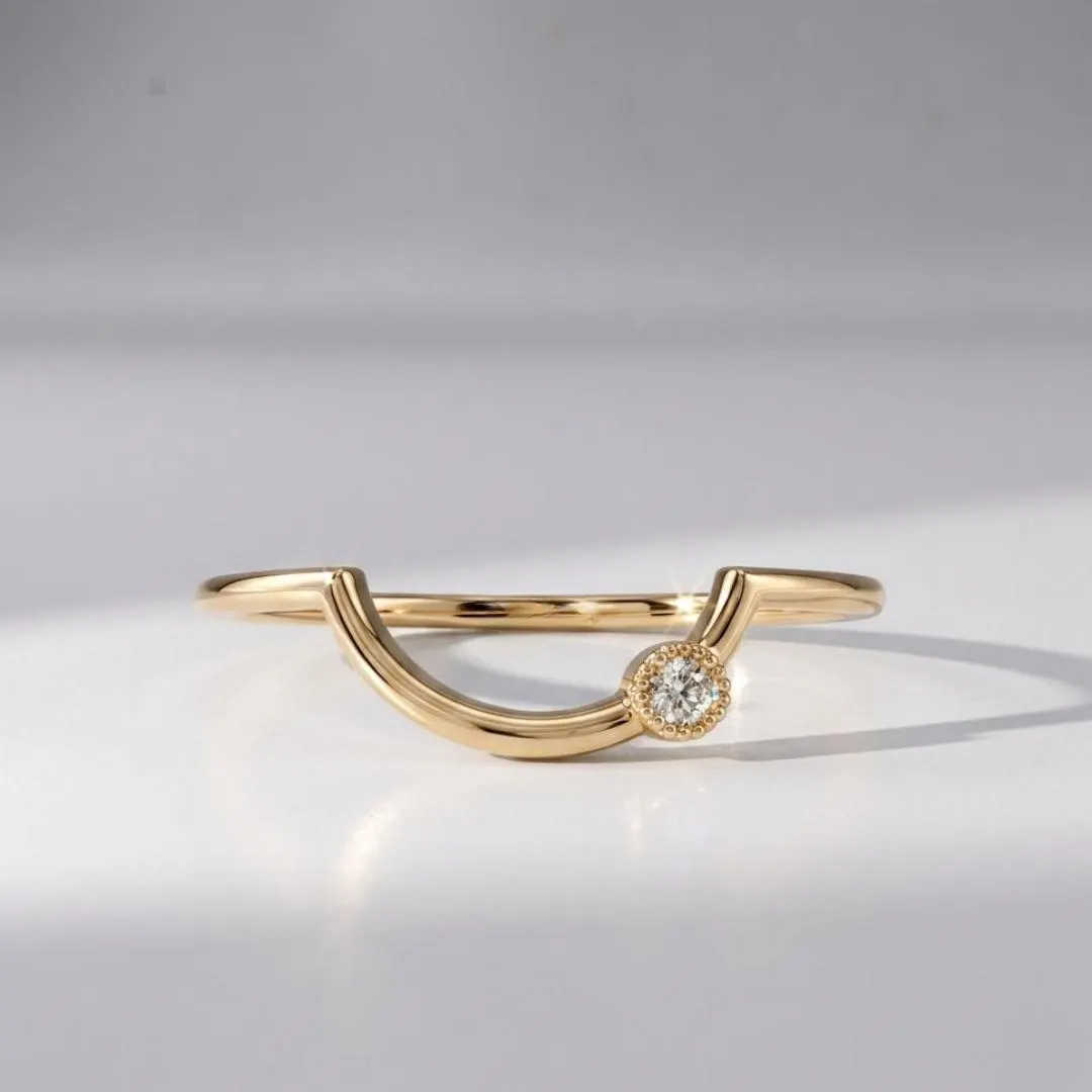 AuvelleCo curved diamond contour wedding band in yellow solid gold with milgrain style bezel