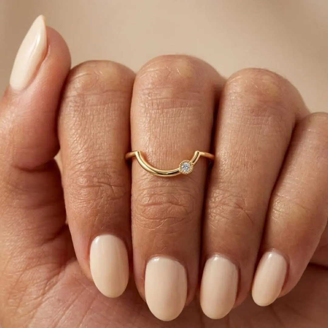 AuvelleCo curved diamond contour wedding band in yellow solid gold with milgrain style bezel