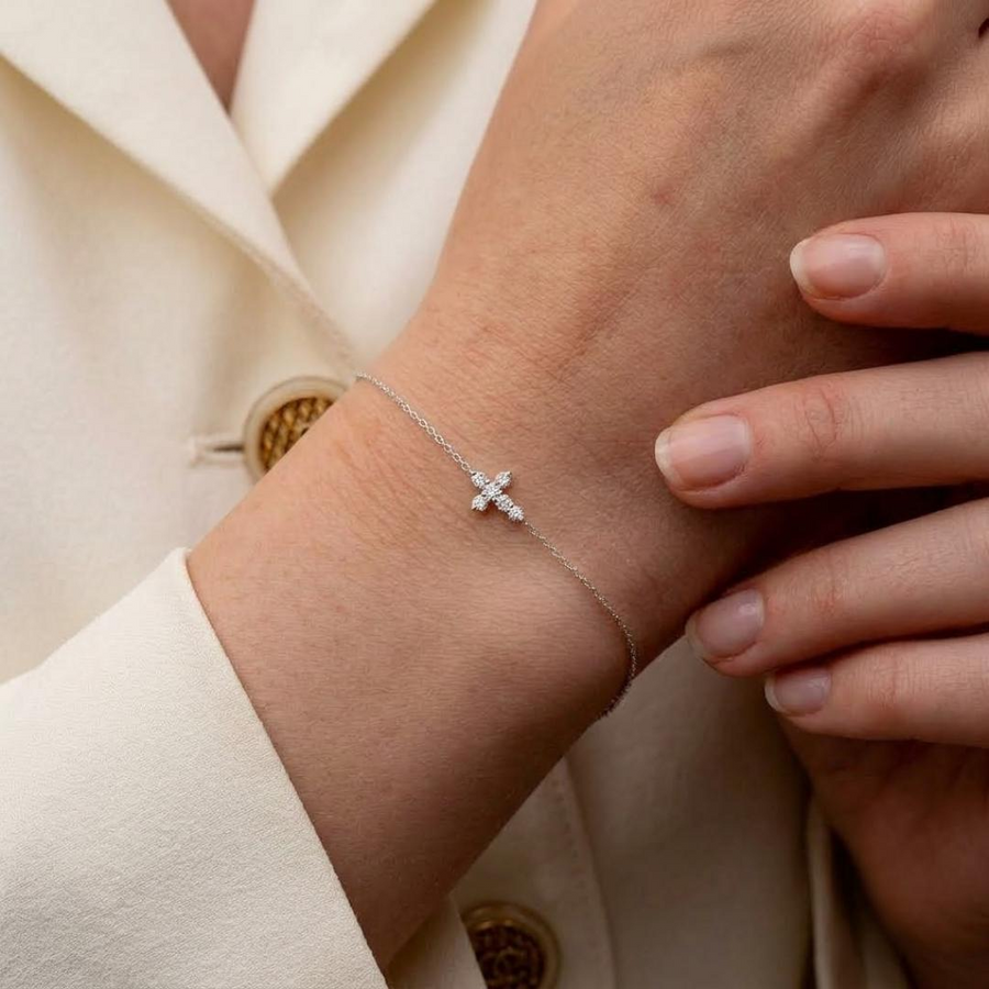 Diamond Cross Chain Bracelet in white gold worn on wrist