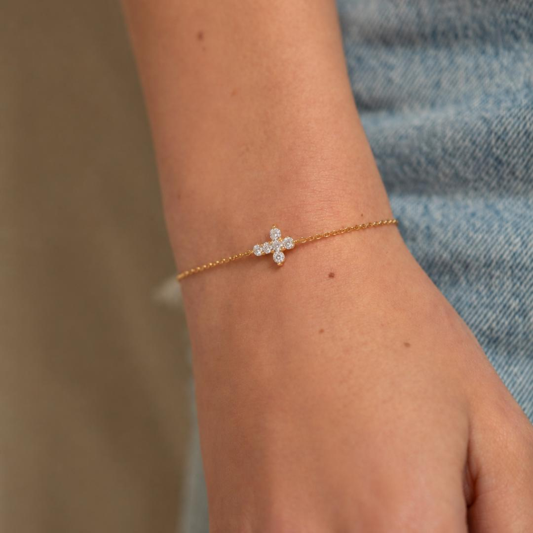 Diamond Cross Chain Bracelet in white gold worn on wrist