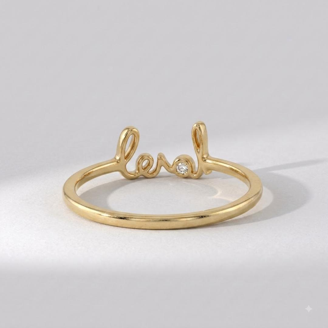 AuvelleCo solid gold love script promise ring with bezel style diamond accent