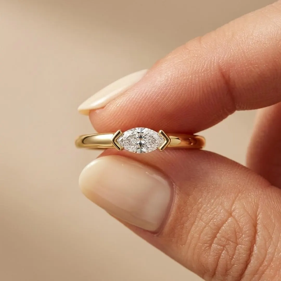 AuvelleCo east west marquise diamond solitaire ring in yellow solid gold