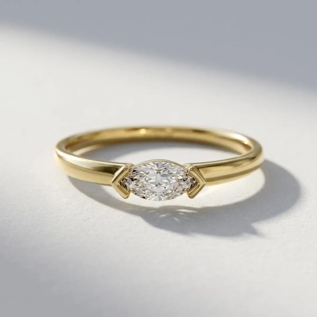AuvelleCo east west marquise diamond solitaire ring in yellow solid gold