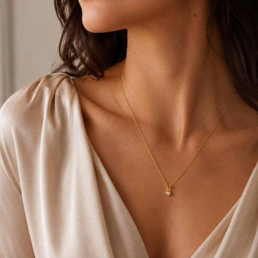 AuvelleCo yellow gold heart lock diamond pendant; chain shown for styling and not included
