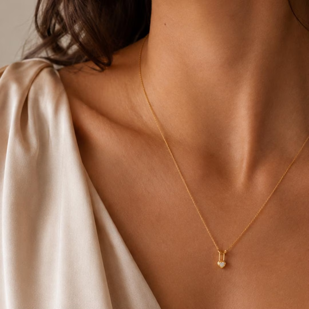 AuvelleCo yellow gold heart lock diamond pendant; chain shown for styling and not included