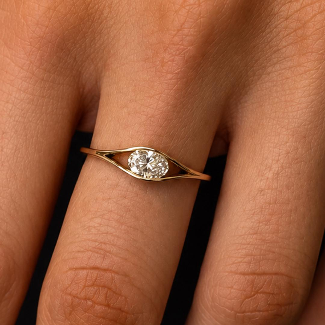 Yellow gold oval diamond solitaire ring with open eye split shank