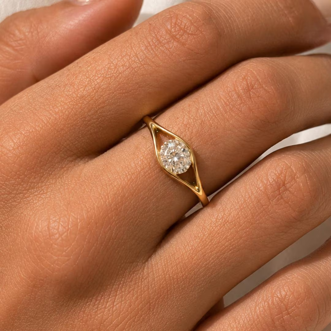Yellow gold oval diamond solitaire ring with open eye split shank