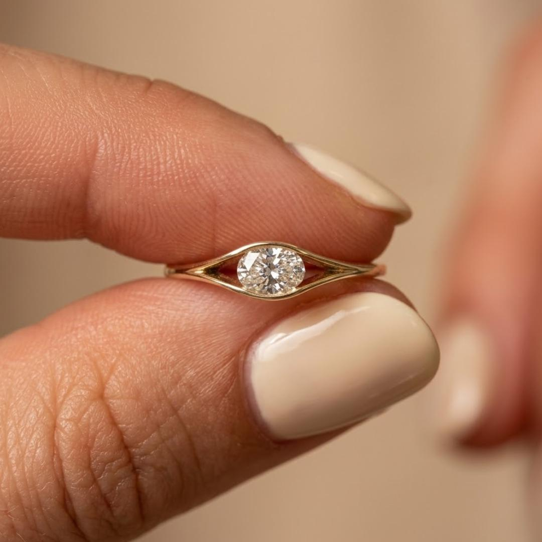 Yellow gold oval diamond solitaire ring with open eye split shank
