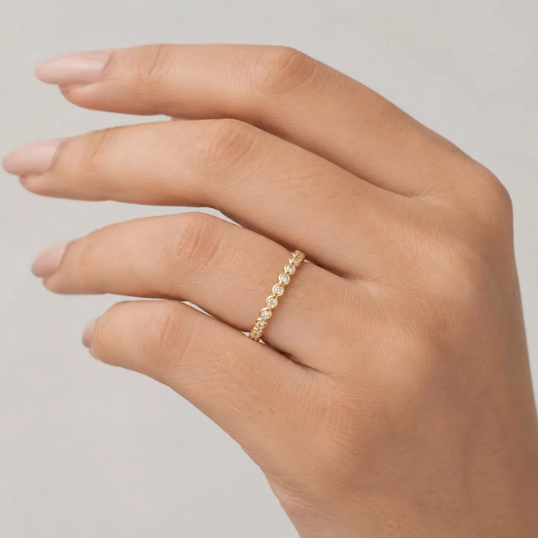 AuvelleCo round diamond full bezel eternity band in solid gold