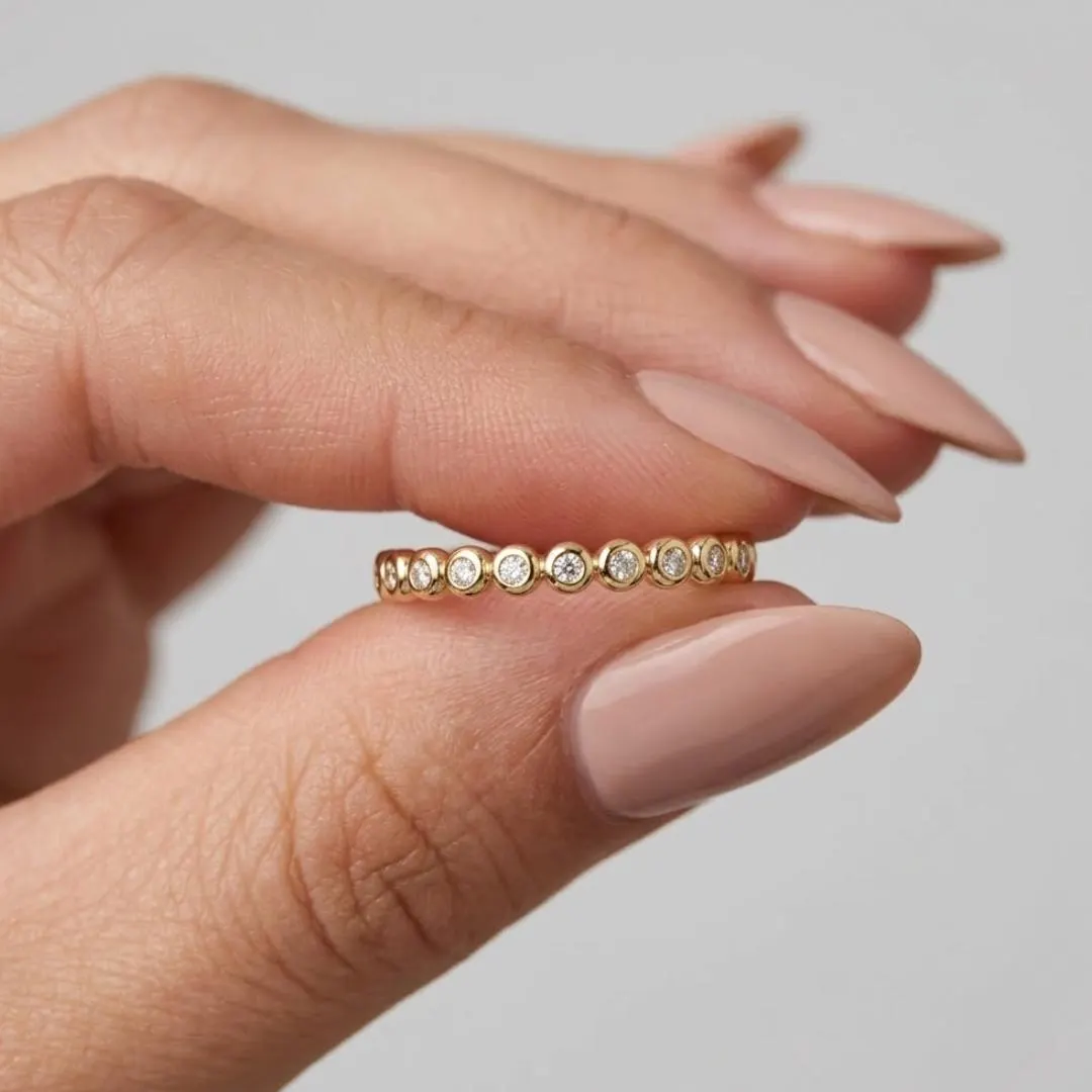 AuvelleCo round diamond full bezel eternity band in solid gold