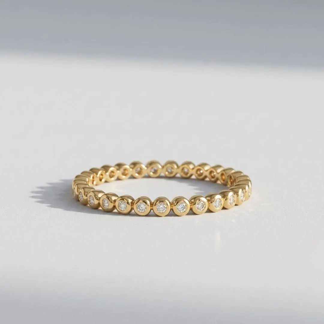 AuvelleCo round diamond full bezel eternity band in solid gold