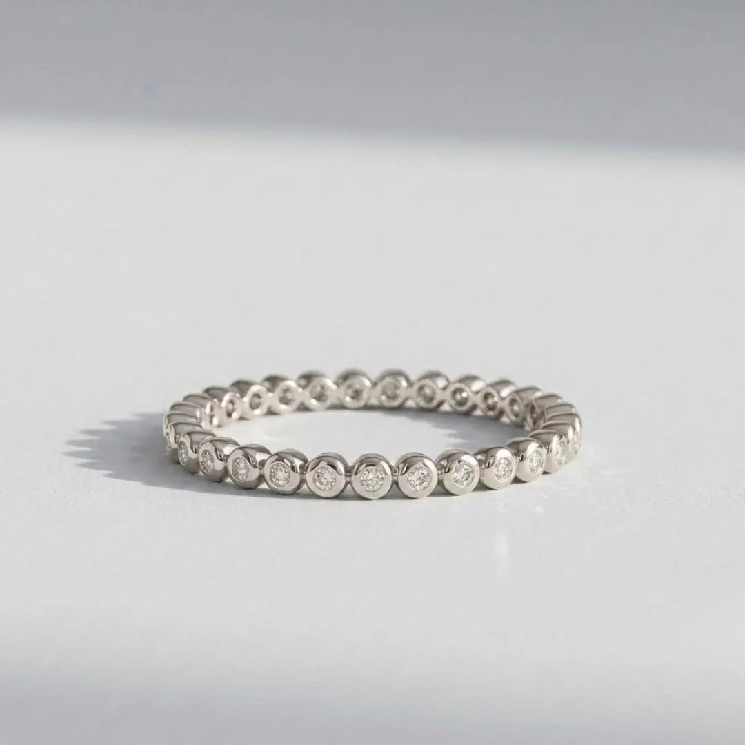 AuvelleCo round diamond full bezel eternity band in solid gold