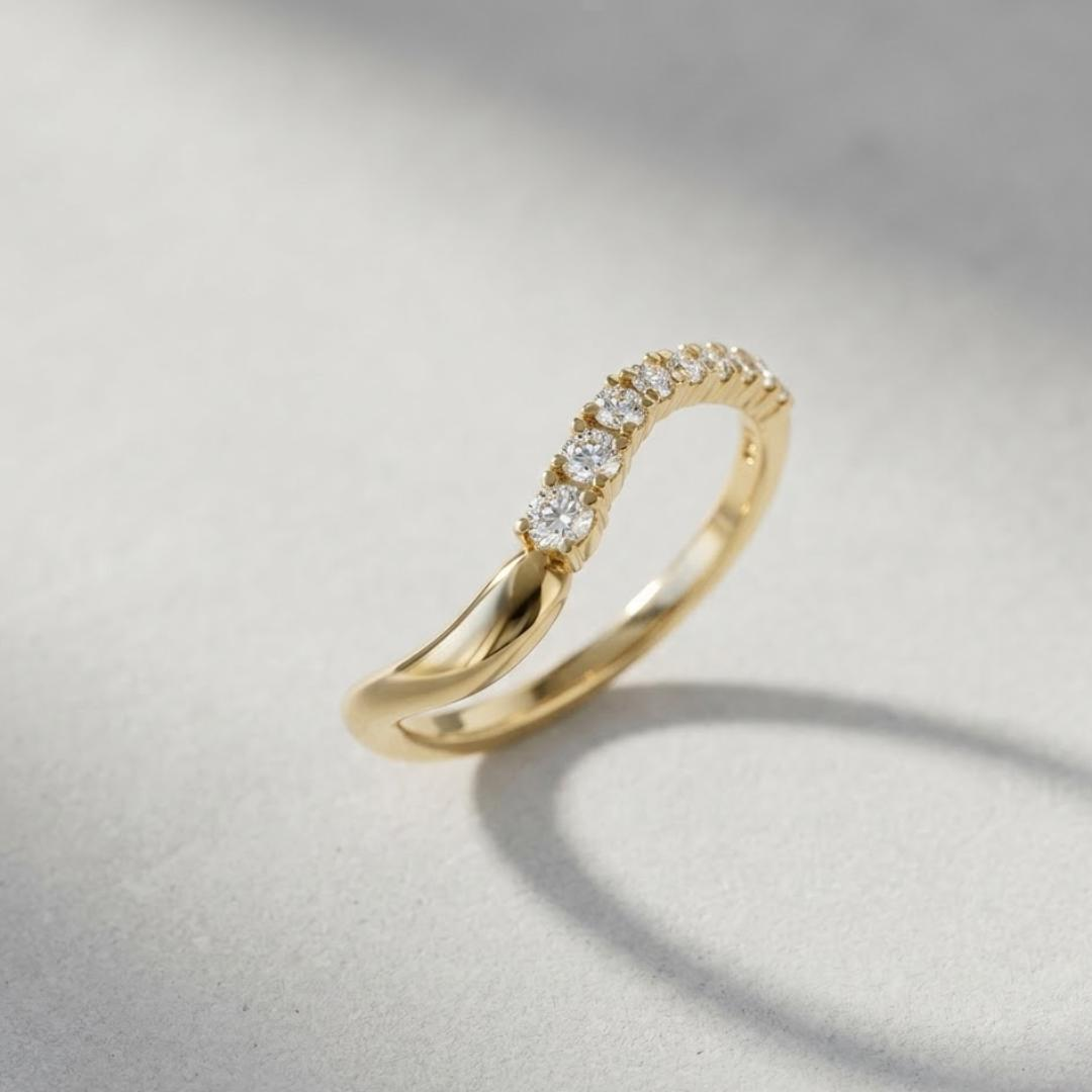 AuvelleCo semi flow pave diamond curved wedding band in yellow solid gold